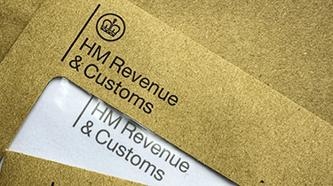 HMRC tax letters. Brown HMRC envelopes. An envelope from the UK tax office HM Revenue and Customs.